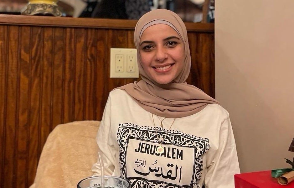 Leqaa Kordia smiling in a beige hijab and cream Jerusalem shirt