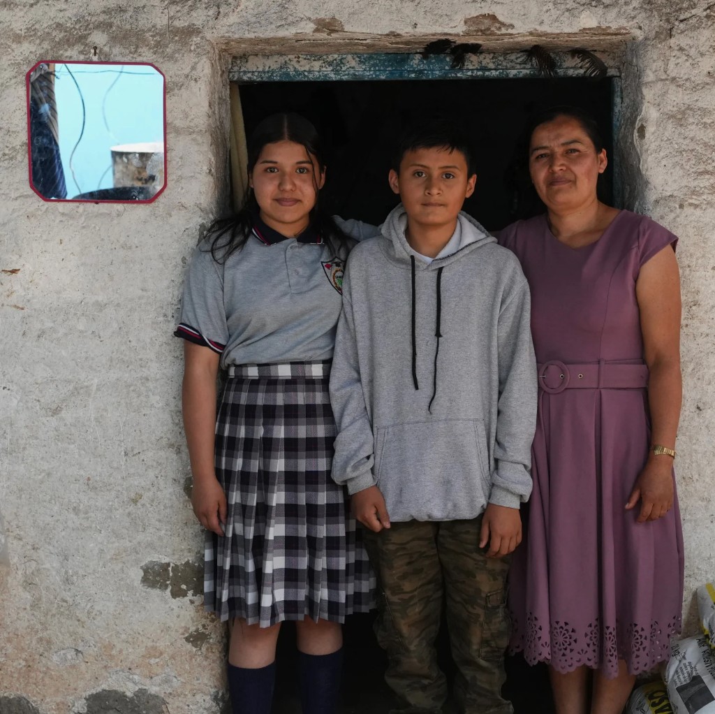 Mirsy Maricela Alva López with her children Ederson and Briseidy at her parents' home in San Martín Cuchumatán, Guatemala