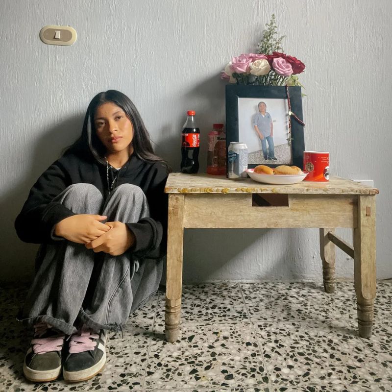 Nory Sontay Ramos next to her mother Estela Ramos Baten's memorial altar in Quetzaltenango, Guatemala